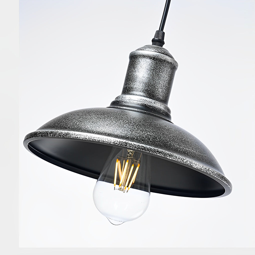 Close-up of bronze pendant lighting showcasing its vintage design and Edison bulb.