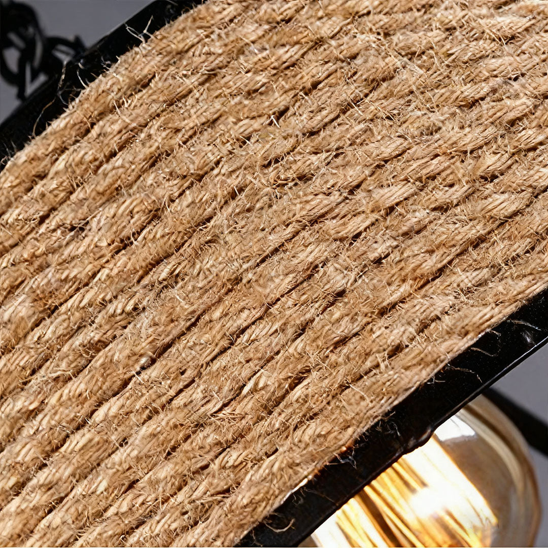 Close-up of circular pendant light bulb, detailed view of warm Edison bulb glow