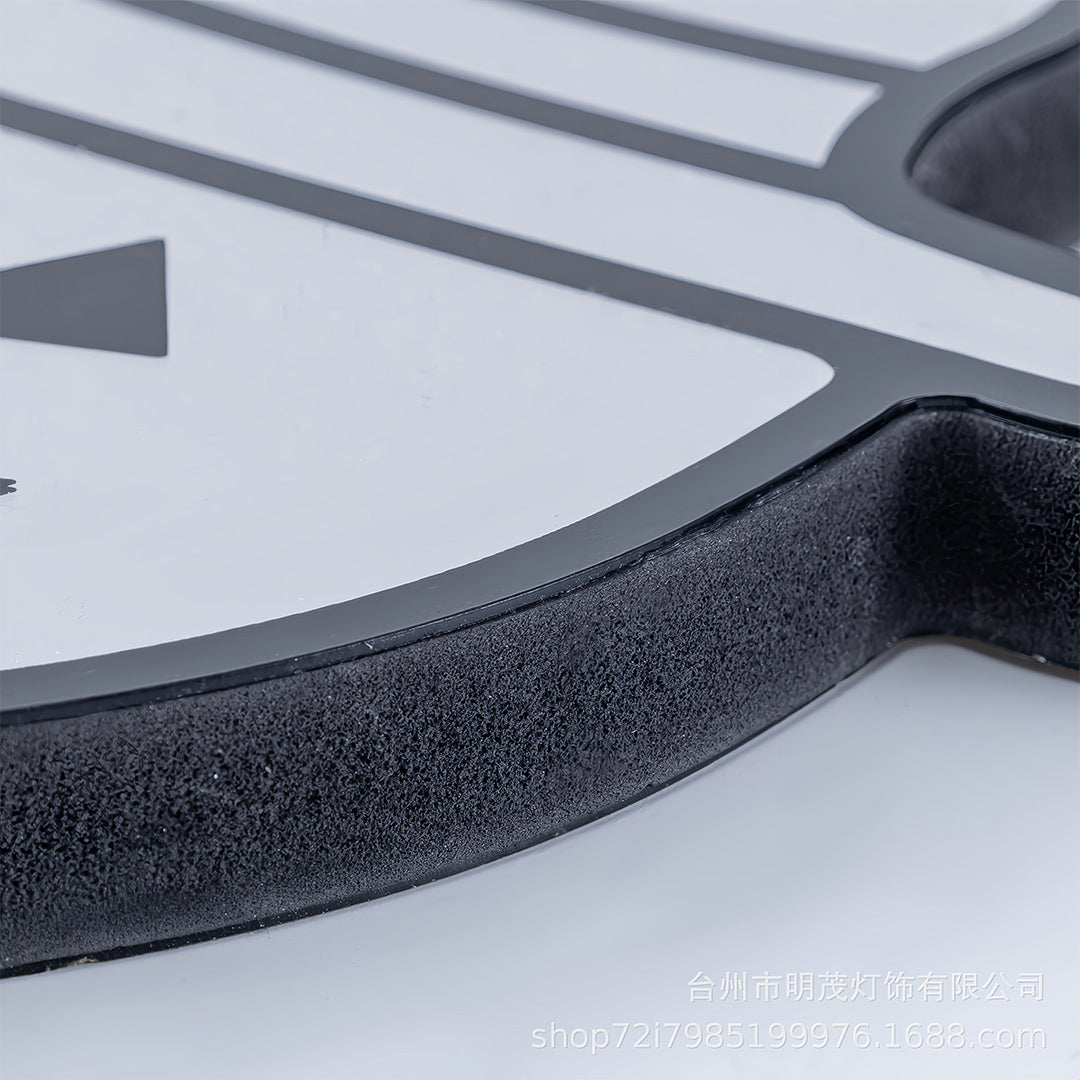 Close-up edge detail of the halloween pumpkin lights showing the clean black trim and smooth acrylic finish.