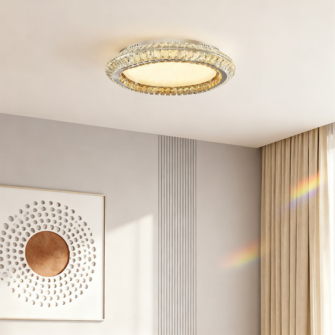 Close-up of a flush mount crystal ceiling light, highlighting the crystal details and gold frame.