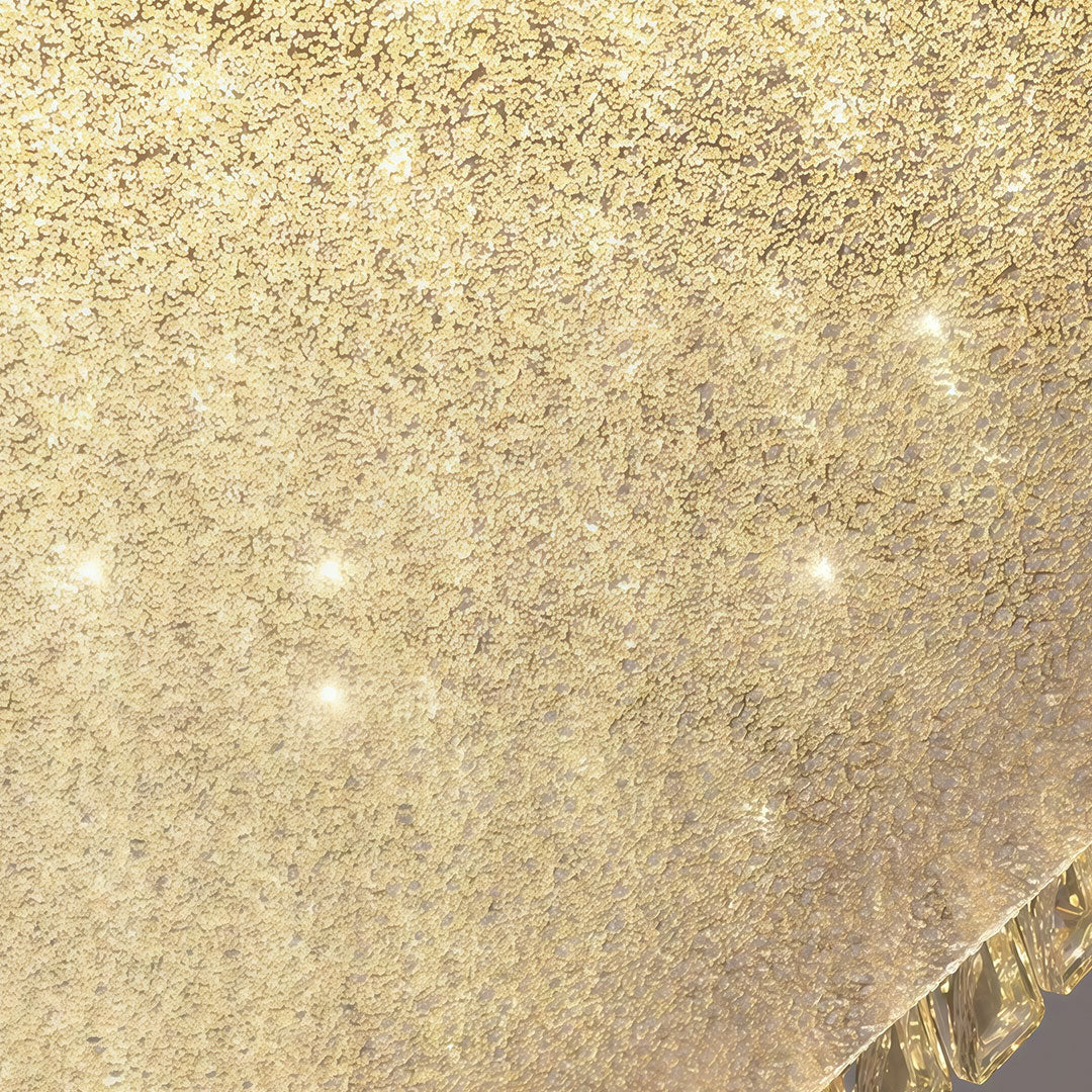 Close-up detail of flush mounted LED lights showing glass shade chandelier inspired crystal ball trim and textured panel.