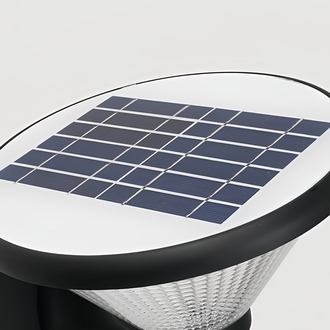 Close-up of funnel wall light showcasing a textured glass shade and solar panel on top.