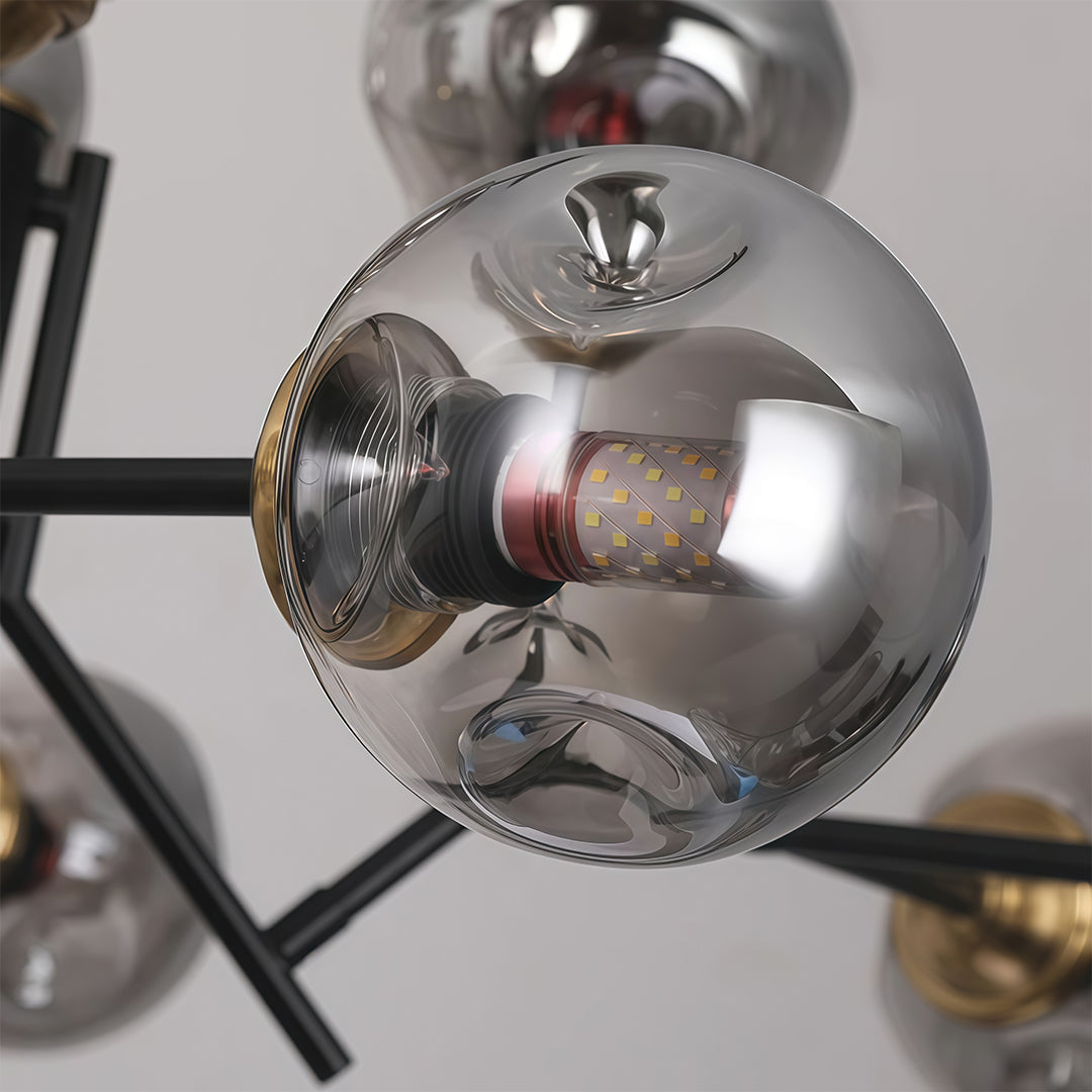 Glass globe chandelier with a close-up of the glass globes, showcasing the intricate design and light reflection.