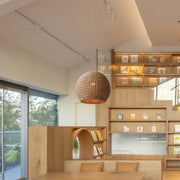 Close-up of a Japanese paper pendant light, showcasing its intricate texture and elegant design.