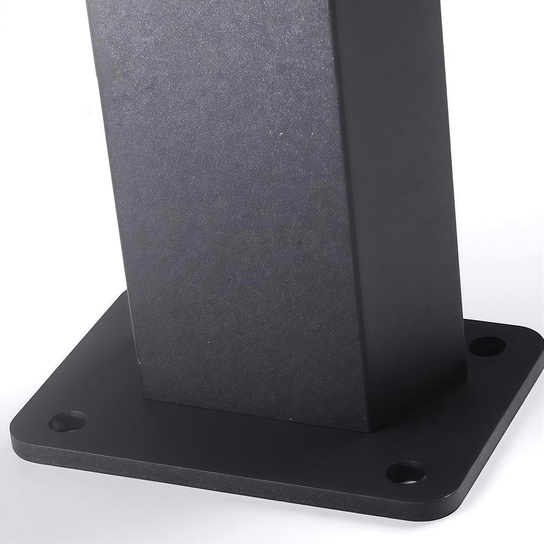 Close-up of LED path light base, showcasing its solar panel and modern design for outdoor lighting.