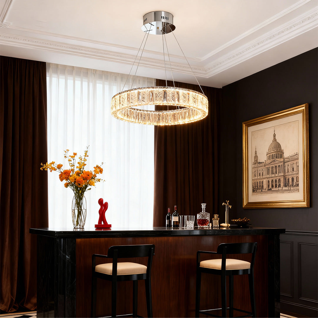 Close-up of an LED ring chandelier, highlighting the crystal details and metallic frame.