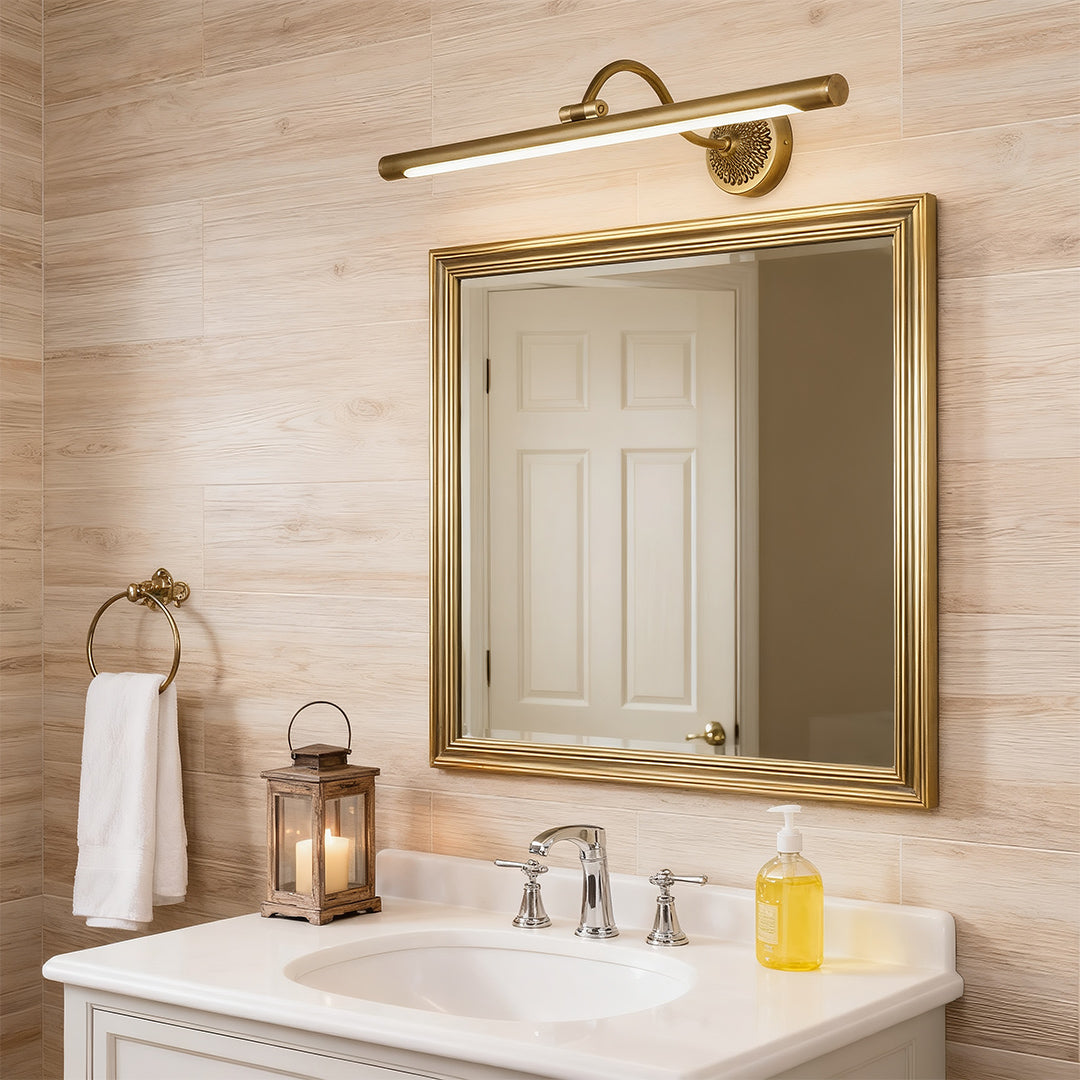 Close-up of LED vanity bathroom lights, showcasing the detailed brass finish and adjustable arm