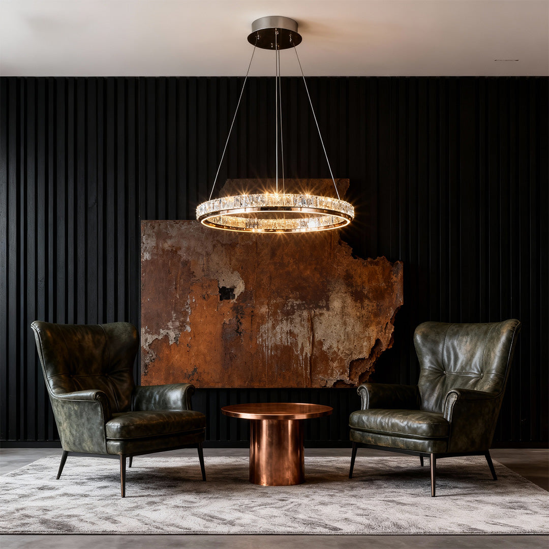 Close-up of a luxury modern chandelier, highlighting the gold and crystal details.