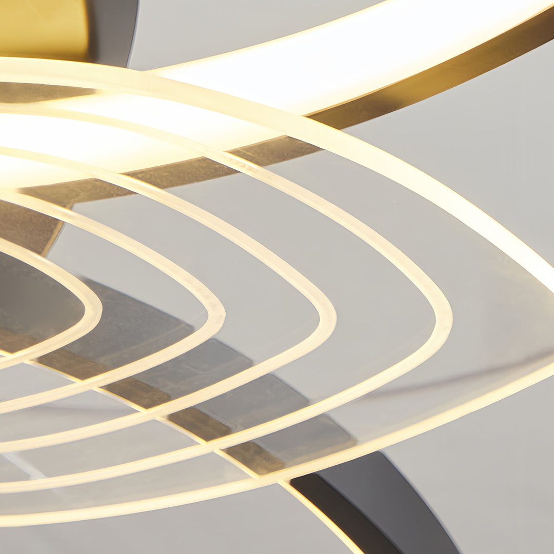 Close-up detail of modern ceiling fan with light showing curved blade design and LED strips