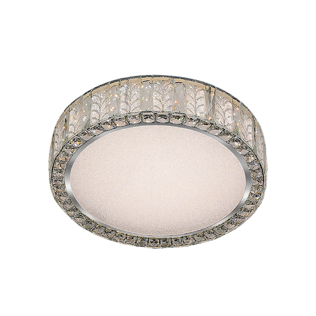 Close-up of a modern flush mount ceiling light, highlighting the crystal details and metallic frame.