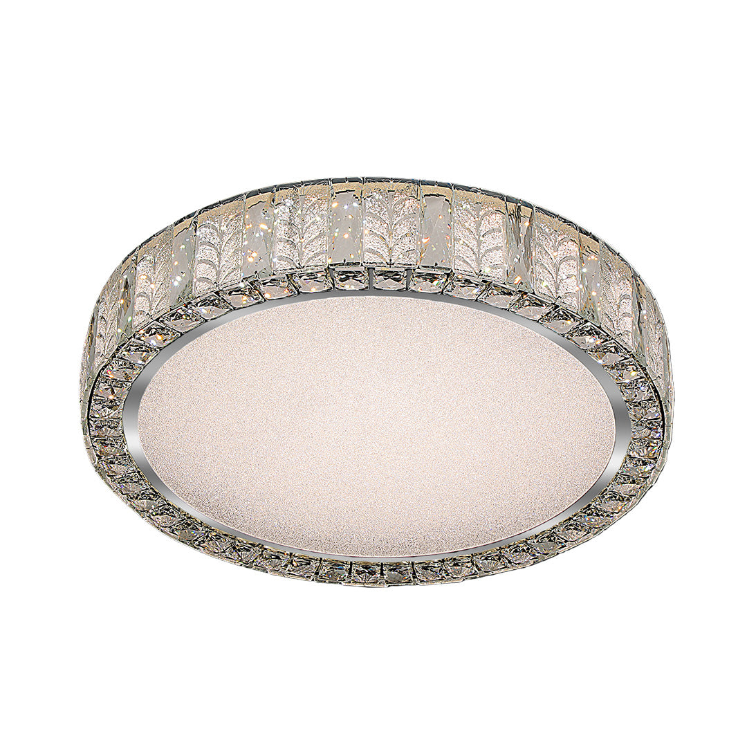 Close-up of a modern flush mount ceiling light, highlighting the crystal details and metallic frame.