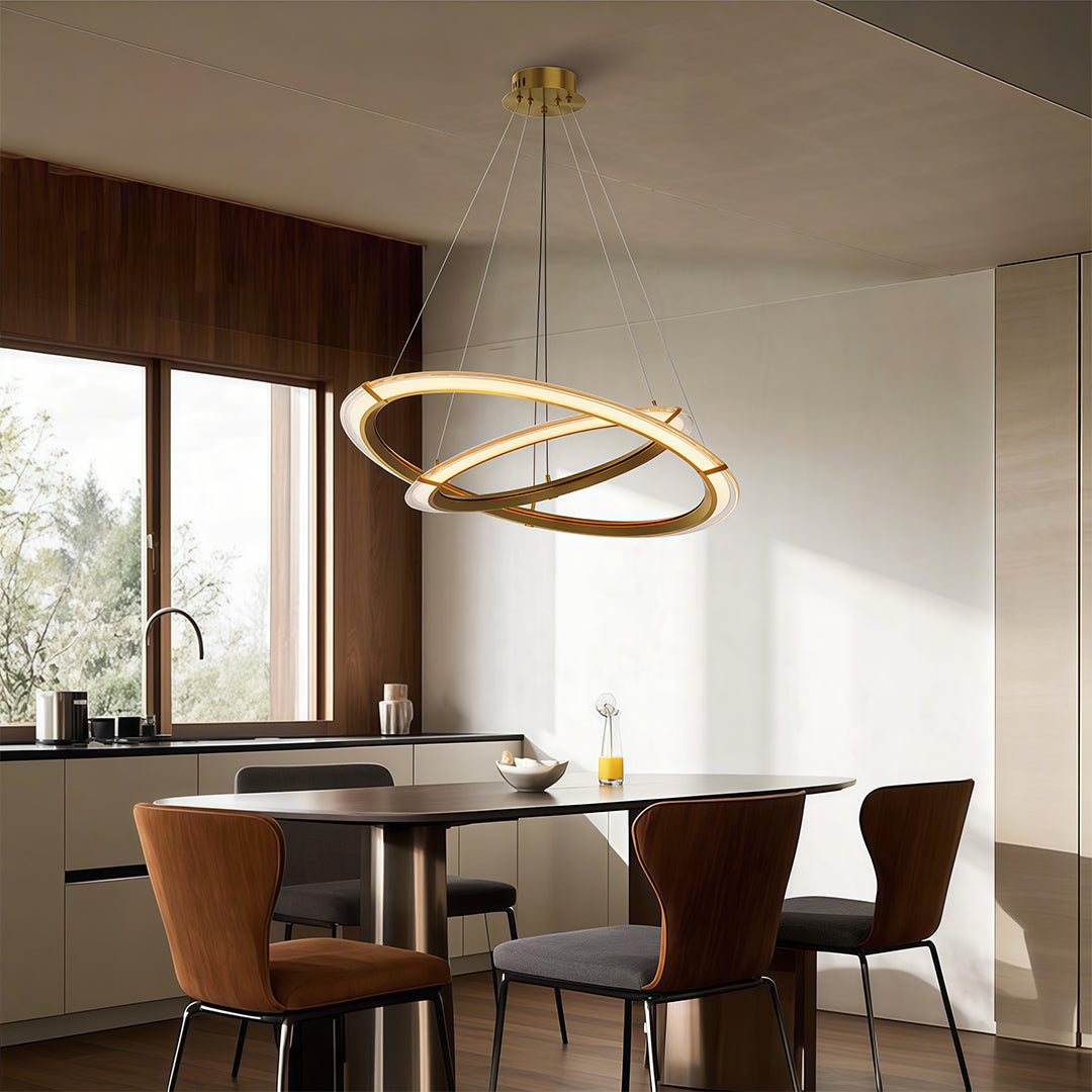 Close-up of a modern round chandelier highlighting the gold finish and circular design.