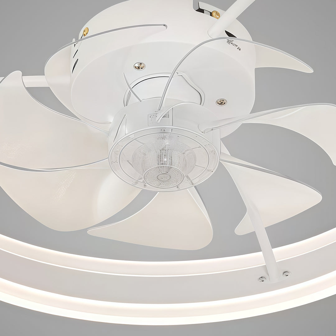 Detailed close-up of the modern white ceiling fan with light highlighting the six aerodynamic blades and central housing. 