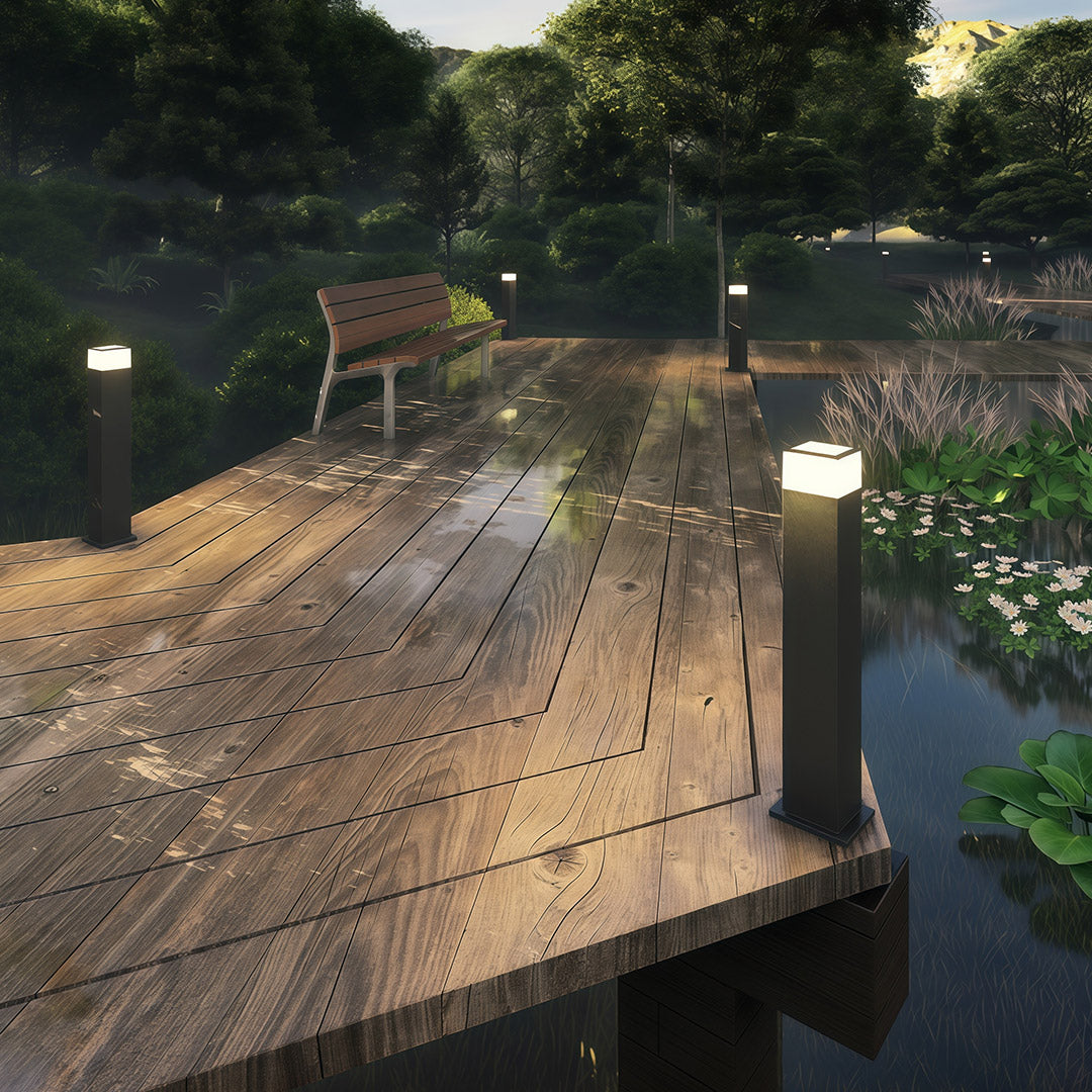 Close-up of a pathway yard light, highlighting the black finish and warm light source.