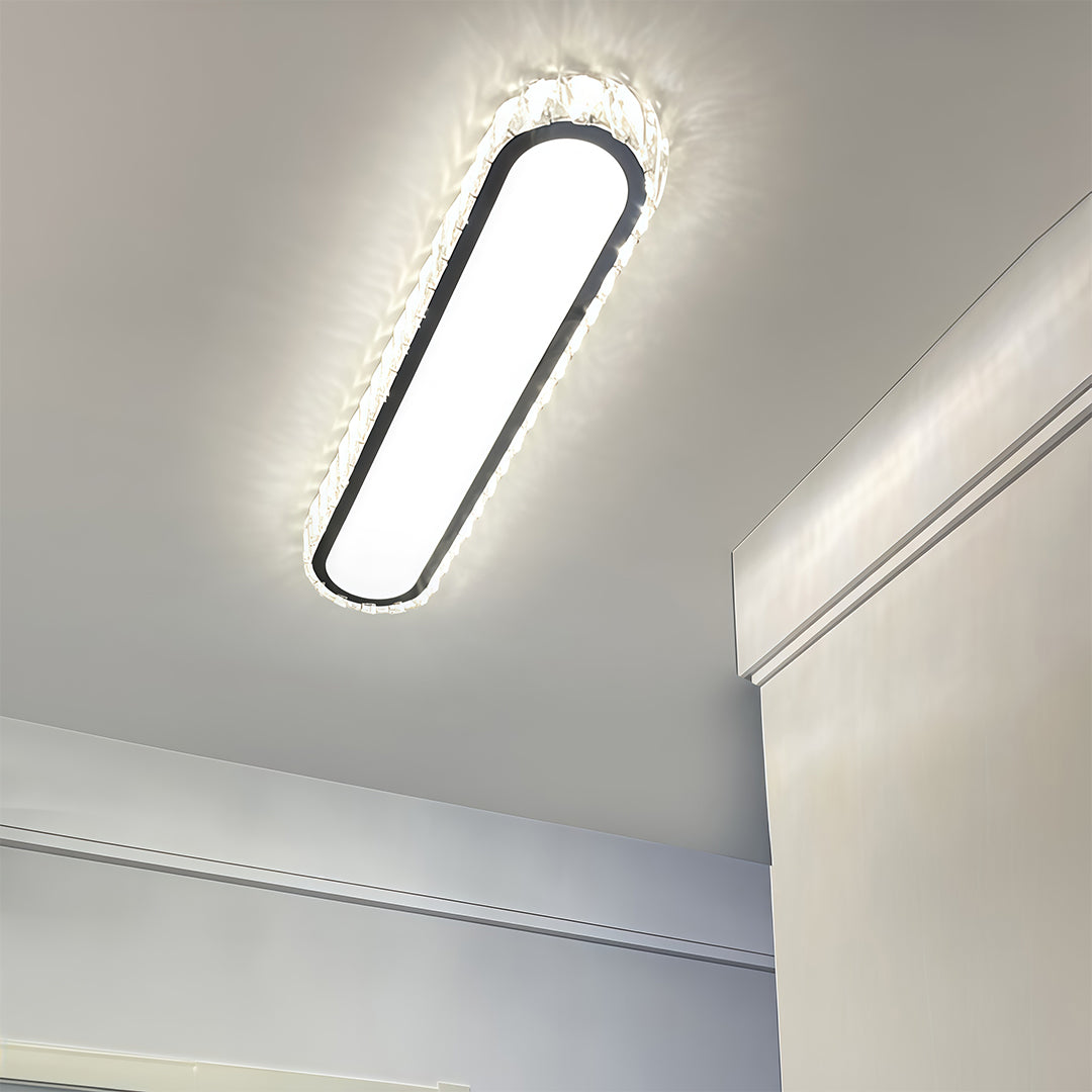 Close-up perspective view of LED flush mount light fixture showing glass shade chandelier inspired crystal trim construction.