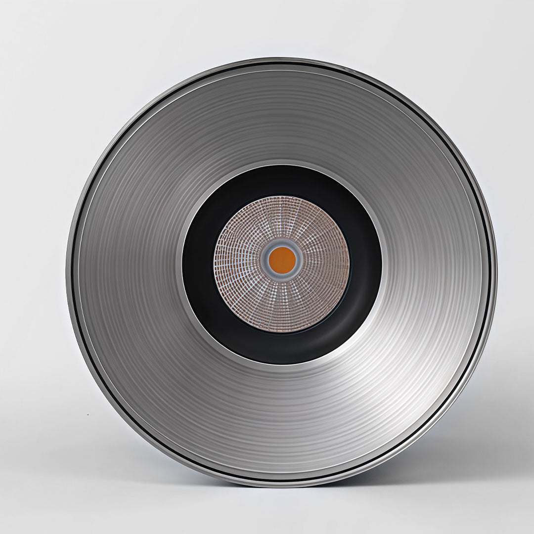 Close-up of a silver surface mount can light showcasing its clean, polished design.