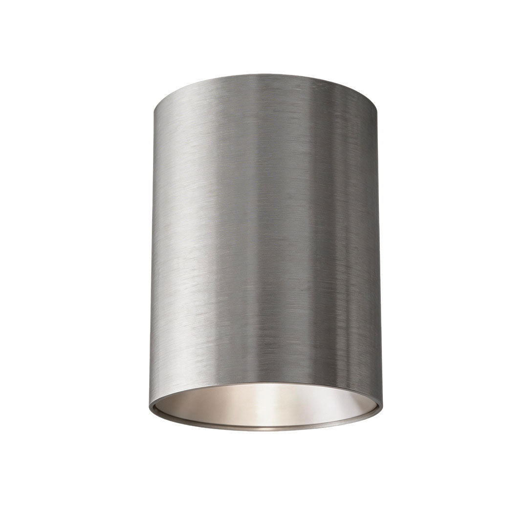 Close-up view of surface mount can light with a brushed metal finish and focused lighting design.