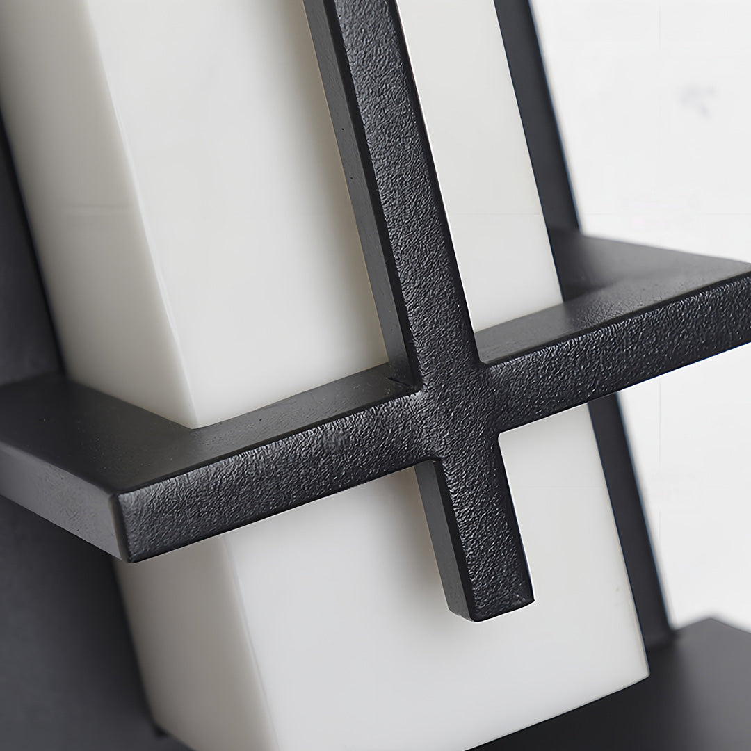 Close-up detail of the textured metal cross-bar on the frame of the black outside wall lights.