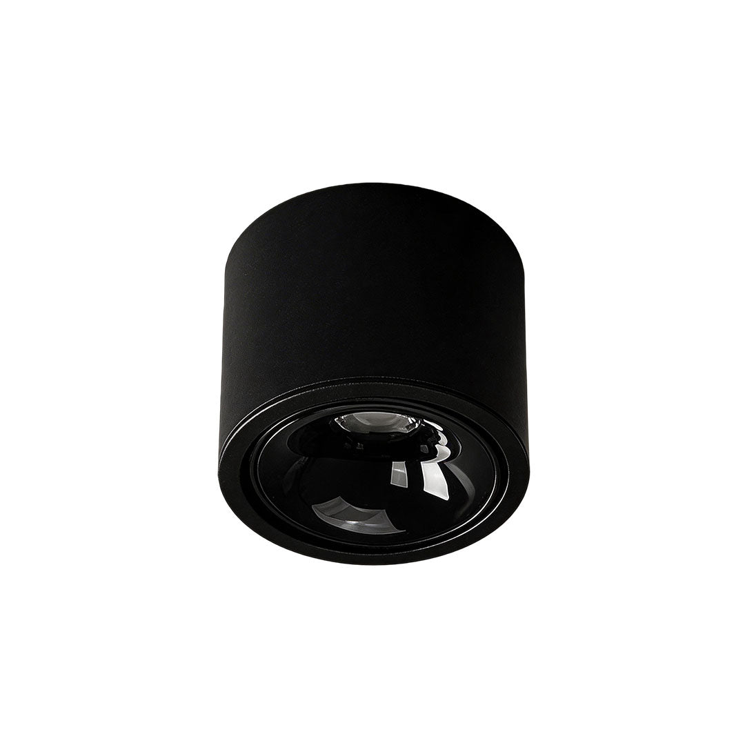 Close-up view of white ceiling spotlight with black interior, emphasizing its design.