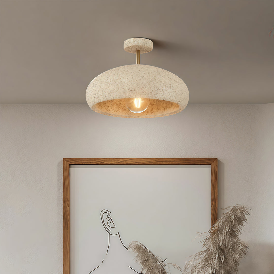 Close-up of white semi flush ceiling lights, showcasing the textured surface and warm light effect.