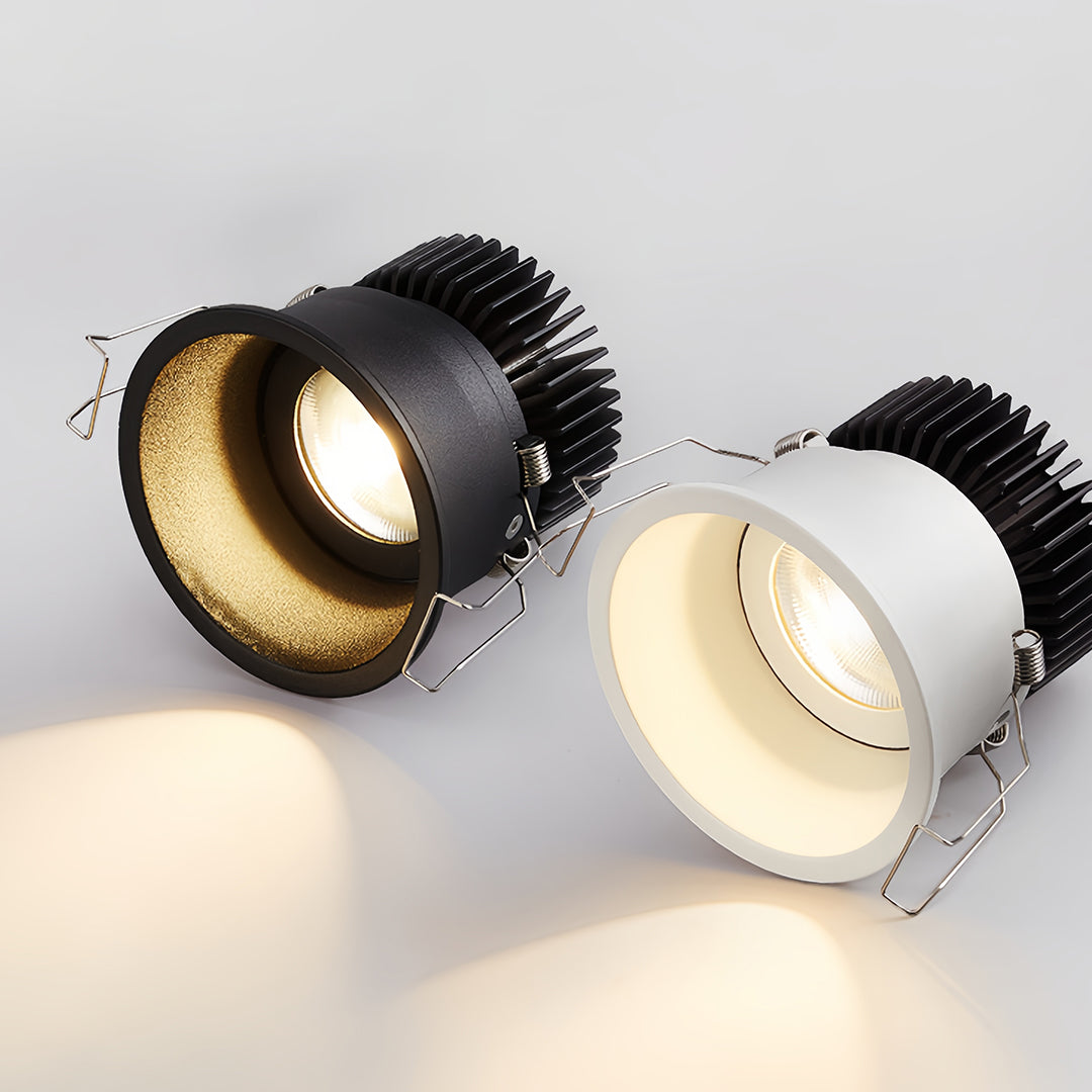 Close-up of a white square recessed downlight showcasing its adjustable spring clips