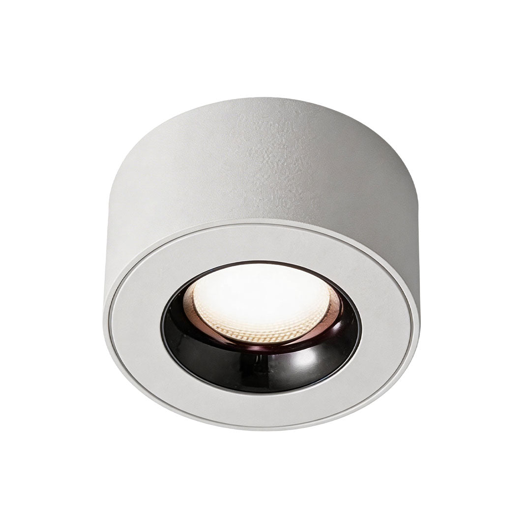 Close-up view of white surface mounted can light showing its clean and modern design.