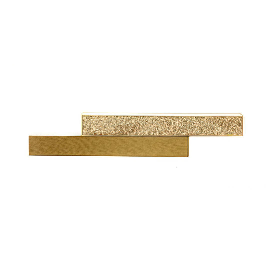 Close-up detail of the linear led wall light, highlighting the light wood grain texture next to the smooth gold metal finish.