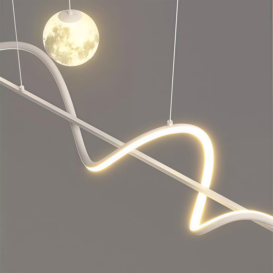 Close-up detail of art deco pendant light showing sculptural wave form with integrated LED strips and globe accent.