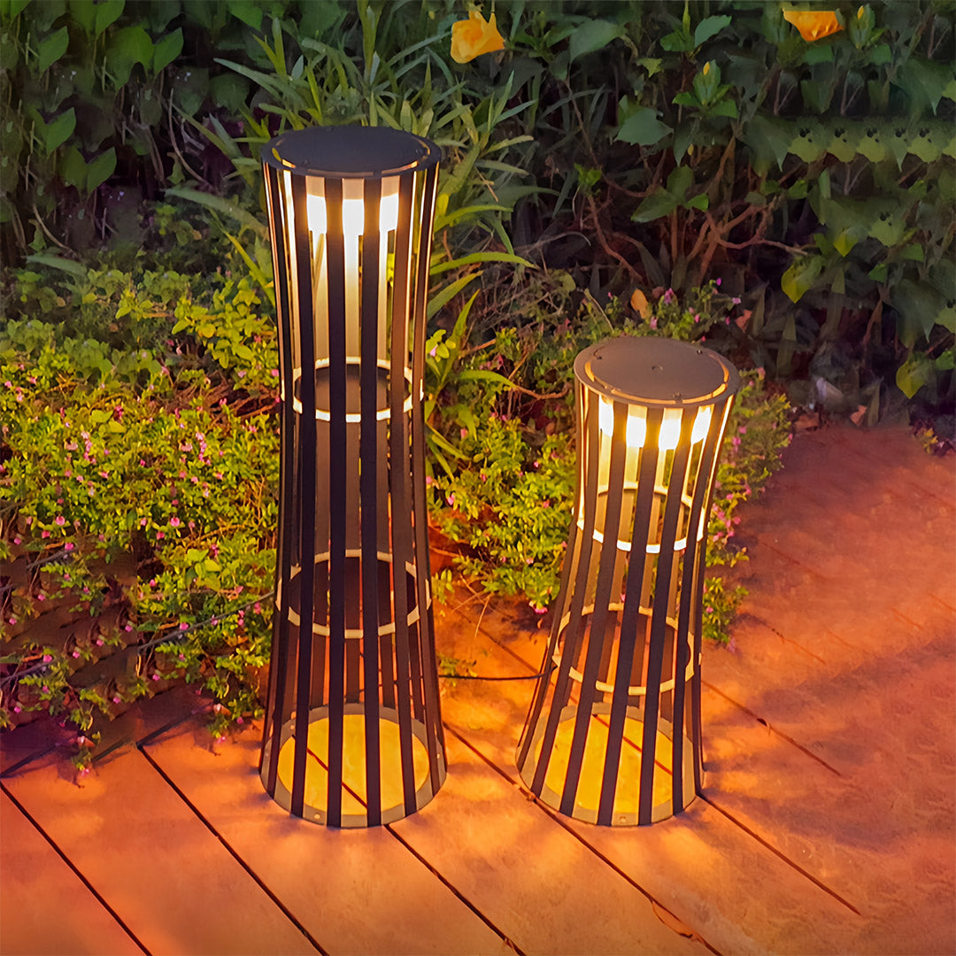 Close-up of a single hanging outdoor black lanterns fixture, highlighting the intricate bamboo cage and bright interior light source.