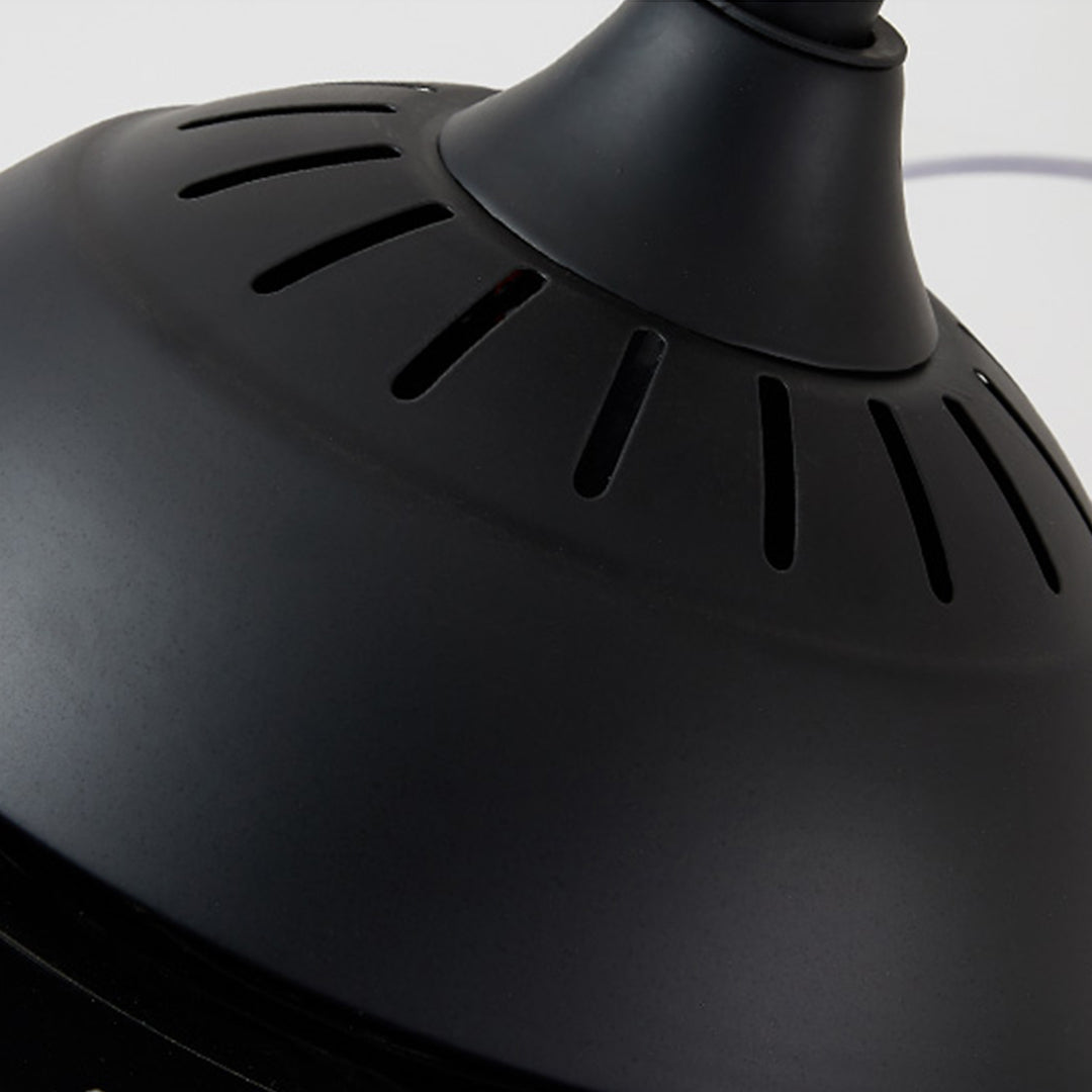 Close-up detail of black ceiling fan motor housing showing ventilation slots and retractable blade mechanism