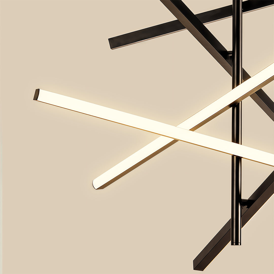 Close-up of black iron linear chandelier showing intersecting arms with LED strip detail.