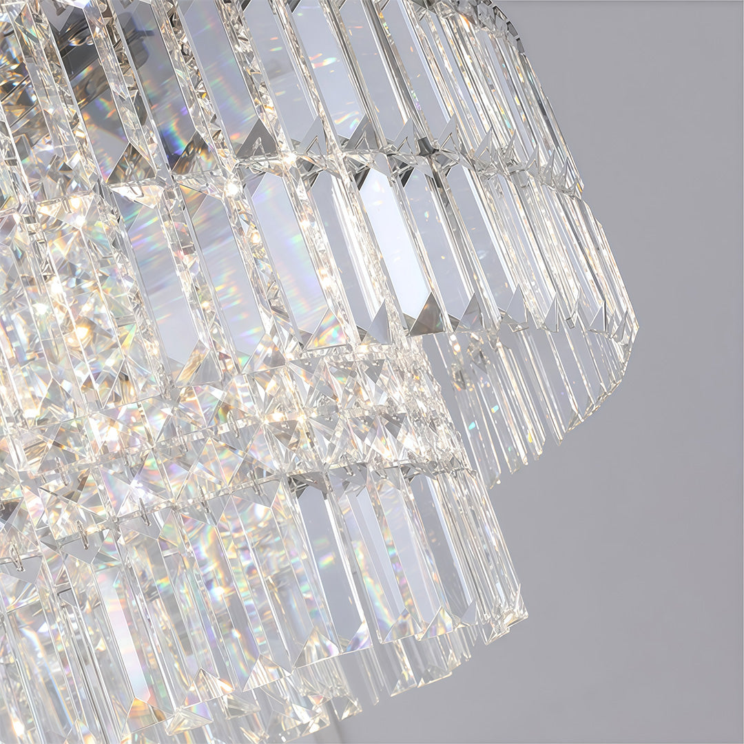 Close-up detail of chandelier with round crystals revealing layered crystal droplets and prism construction.