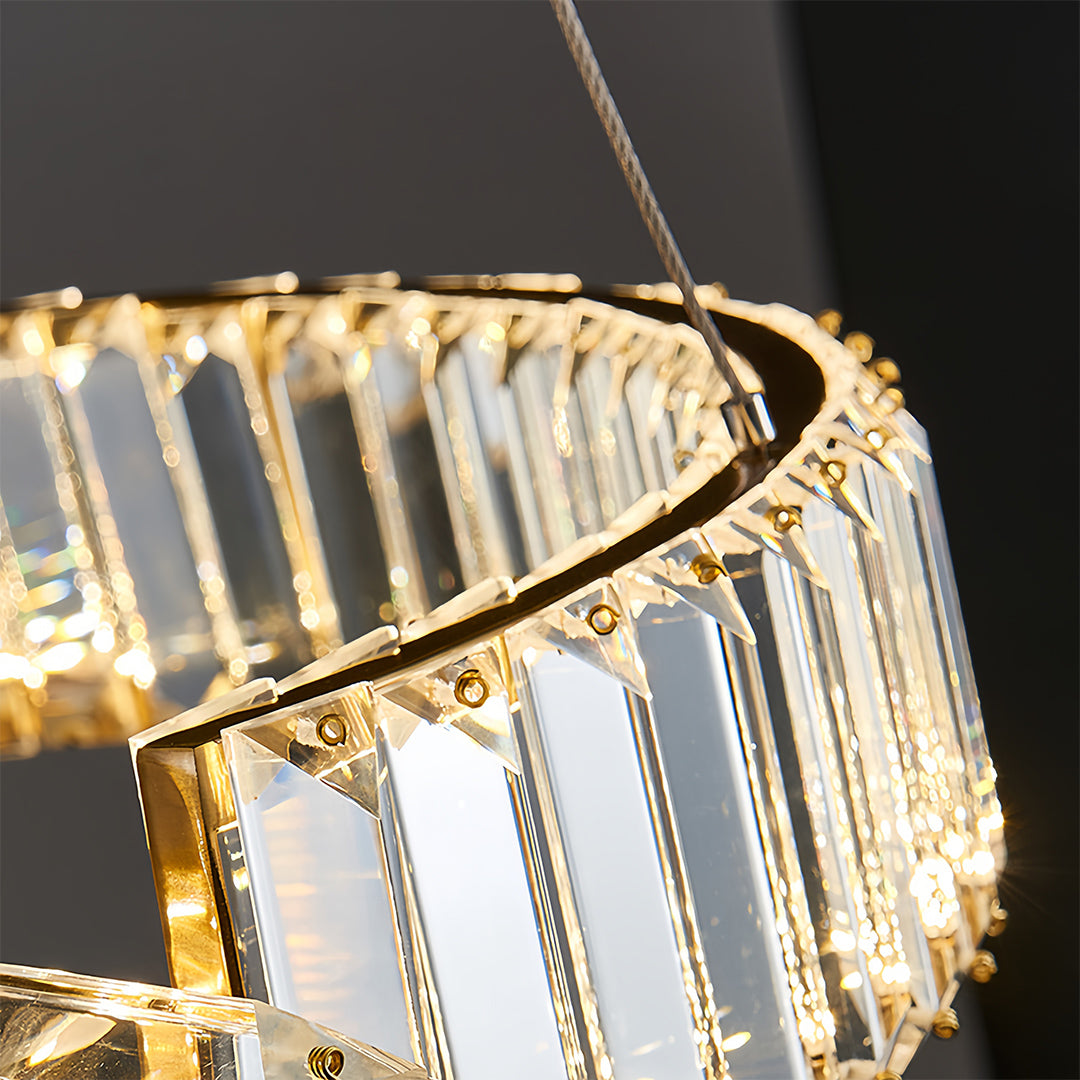 Close-up detail of gold crystal chandelier showing intricate crystal arrangement and metalwork