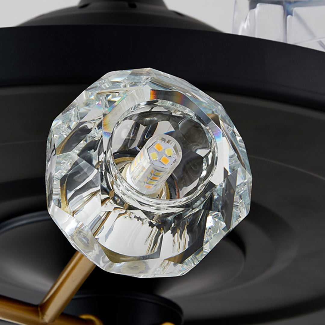 Close-up of crystal glass light shade with faceted diamond-cut design for ceiling fan fixture