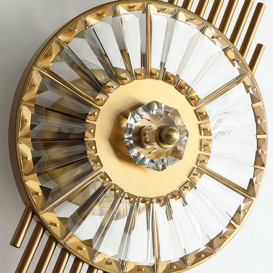 Close-up of crystal light wall featuring glass shade chandelier styling highlighting circular crystal disc and starburst metal construction.