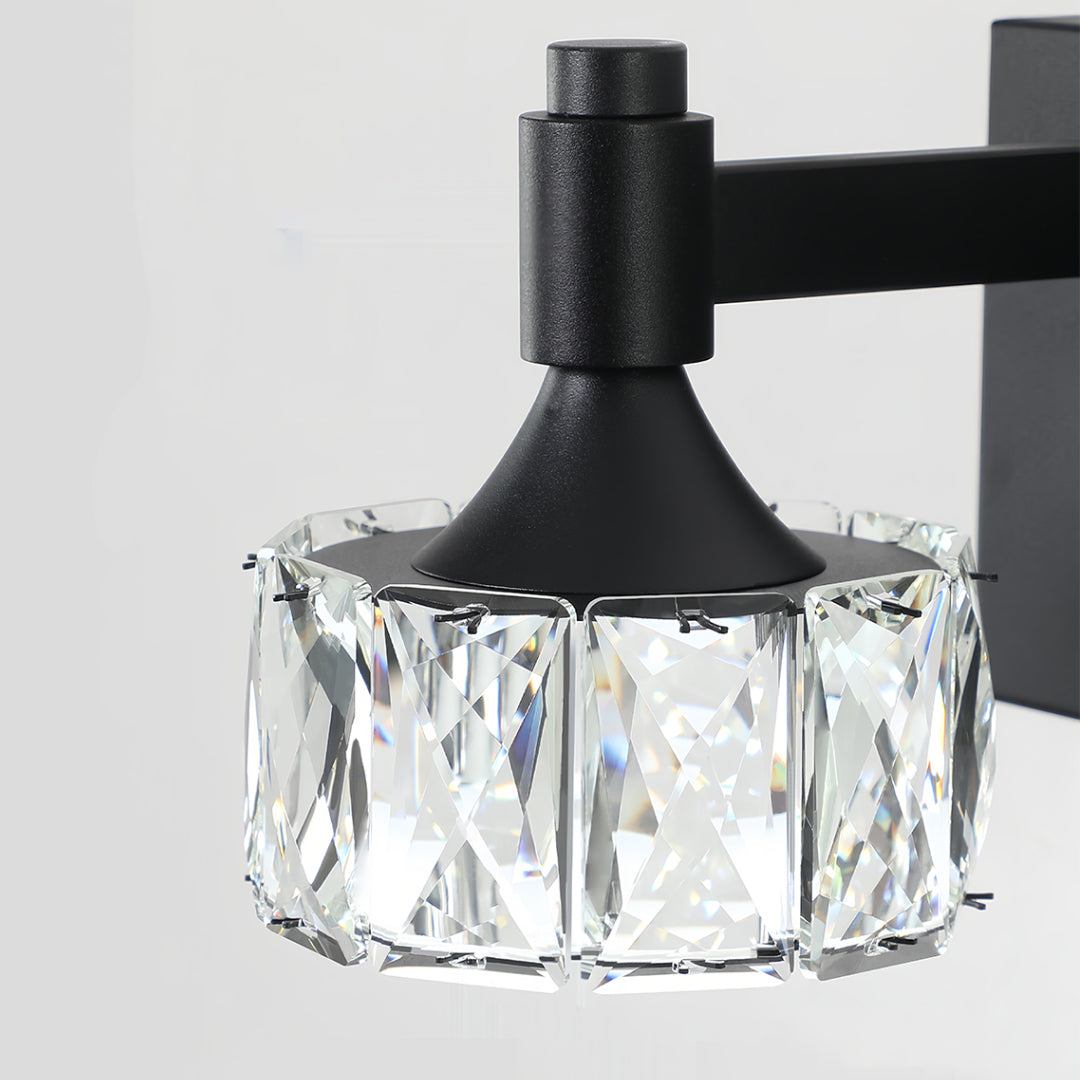 Close-up of crystal bathroom vanity light fixture with glass shade chandelier inspired geometric cube crystal design.