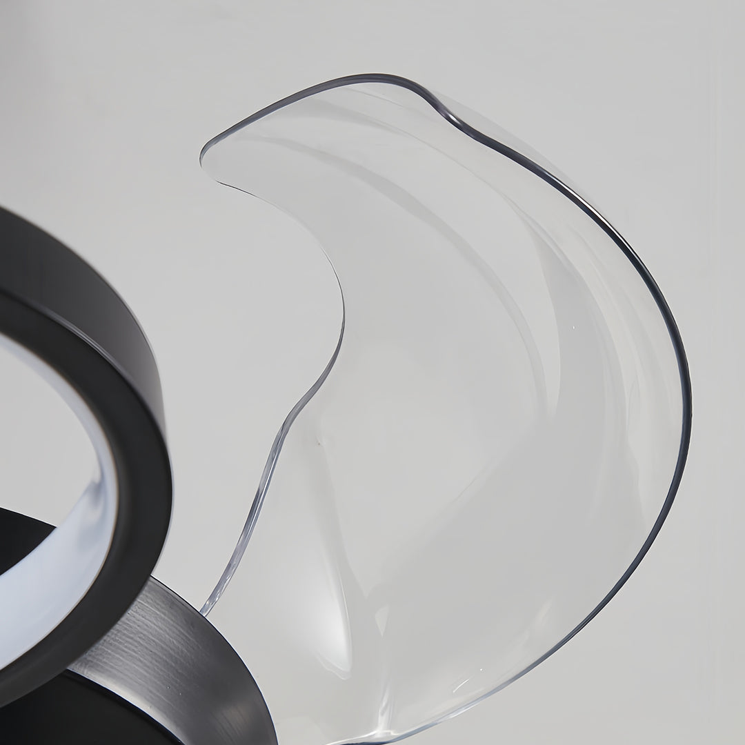 Close-up of curved blades on a ceiling fans with multiple lights, highlighting its aerodynamic design