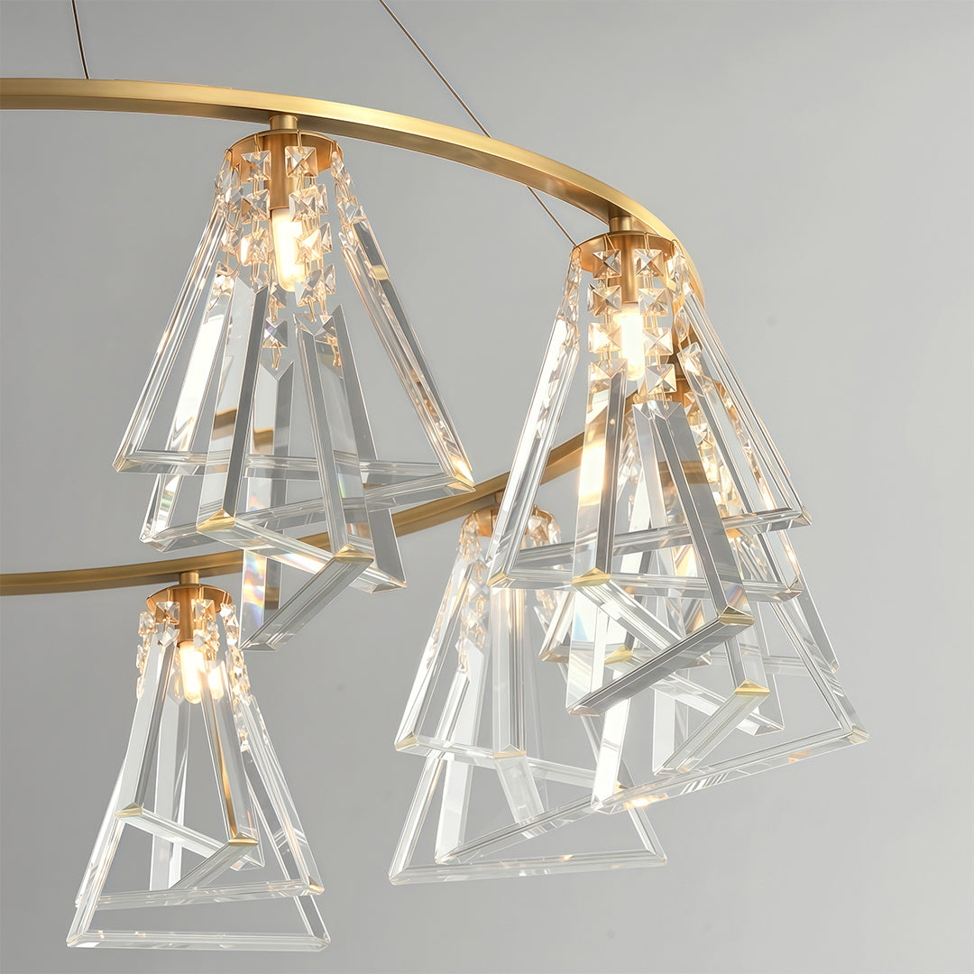 Close-up detail of contemporary crystal chandelier with glass shade chandelier aesthetic highlighting brass construction and faceted crystal detail.
