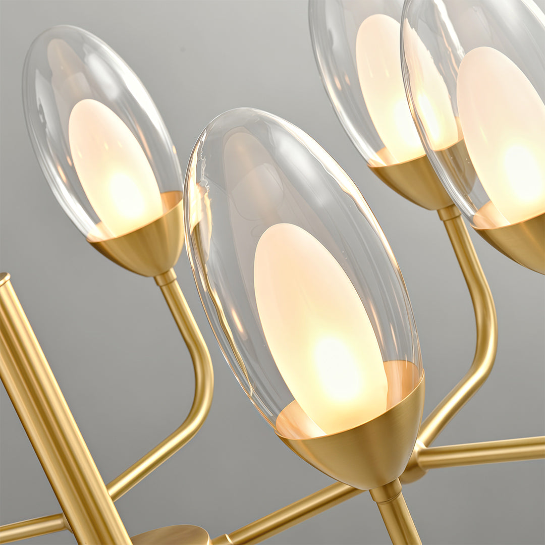 Close-up detail of modern minimalist chandelier with glass shade chandelier aesthetic highlighting brass construction and flame-bulb detail.