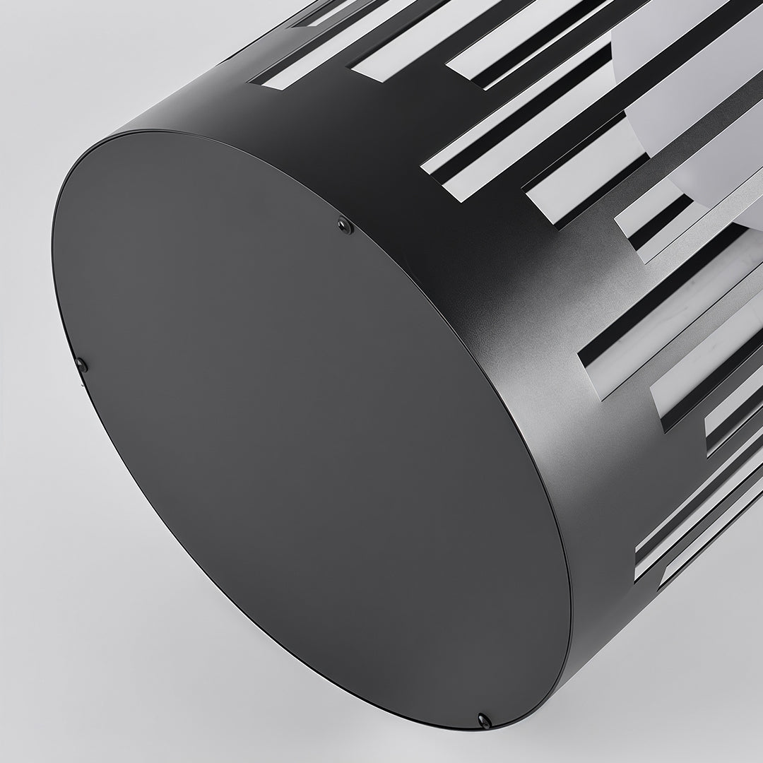 Close-up detail of outdoor lantern light featuring glass shade chandelier design showing cylindrical black housing with vertical cutouts.