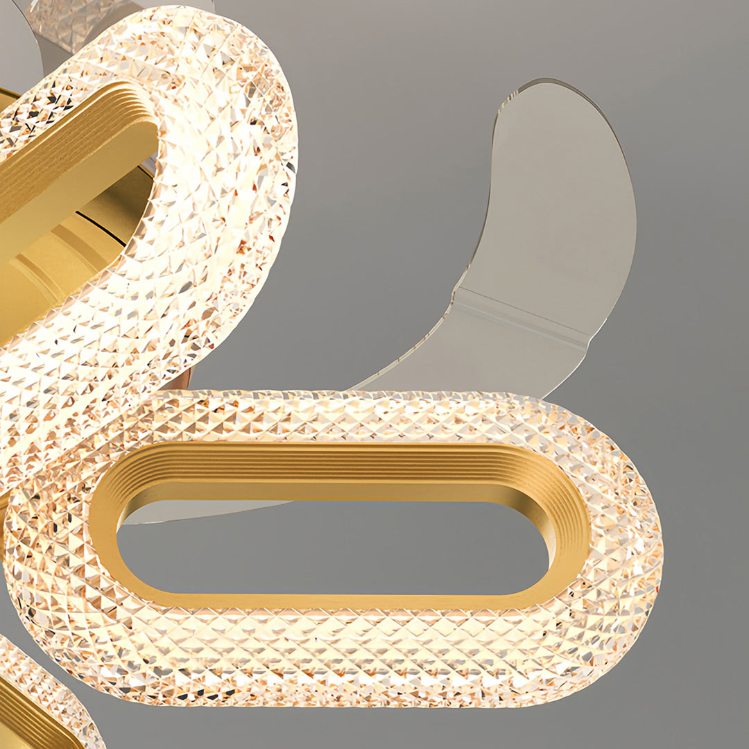 Detailed view of gold ceiling fans with lights, emphasizing the unique and luxurious blade design