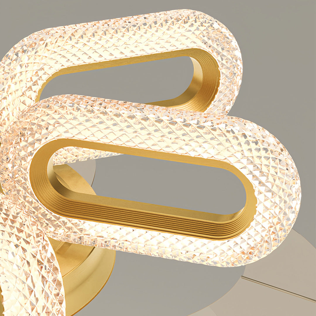 Detailed view of gold ceiling fans with lights, emphasizing the unique and luxurious blade design