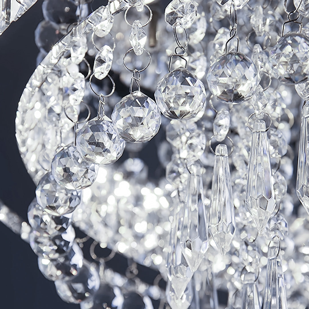 Close-up gold flush mount light crystal detail revealing sparkling faceted design and light refraction quality