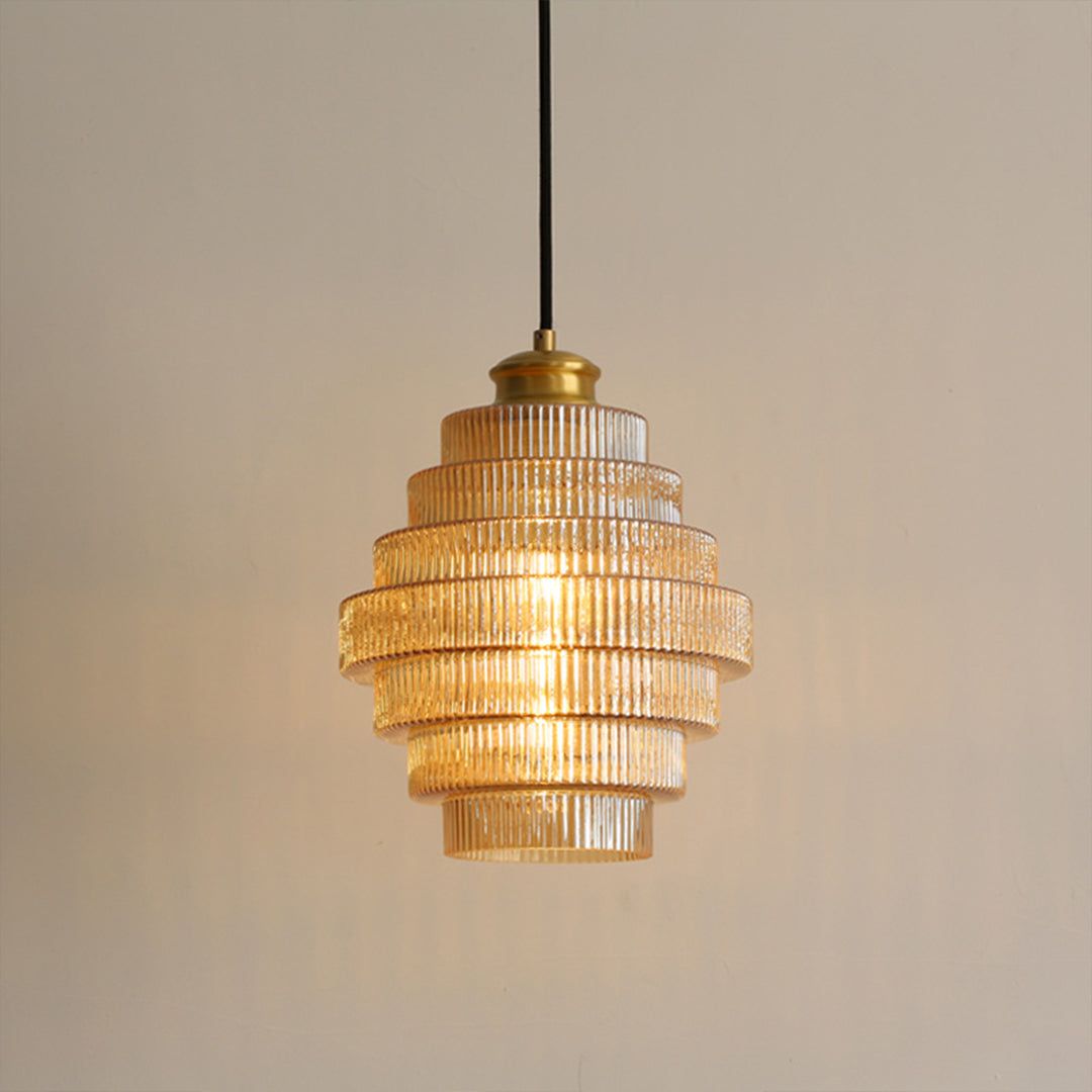 Close-up of honeycomb pendant light top, detailed view of gold and layered design