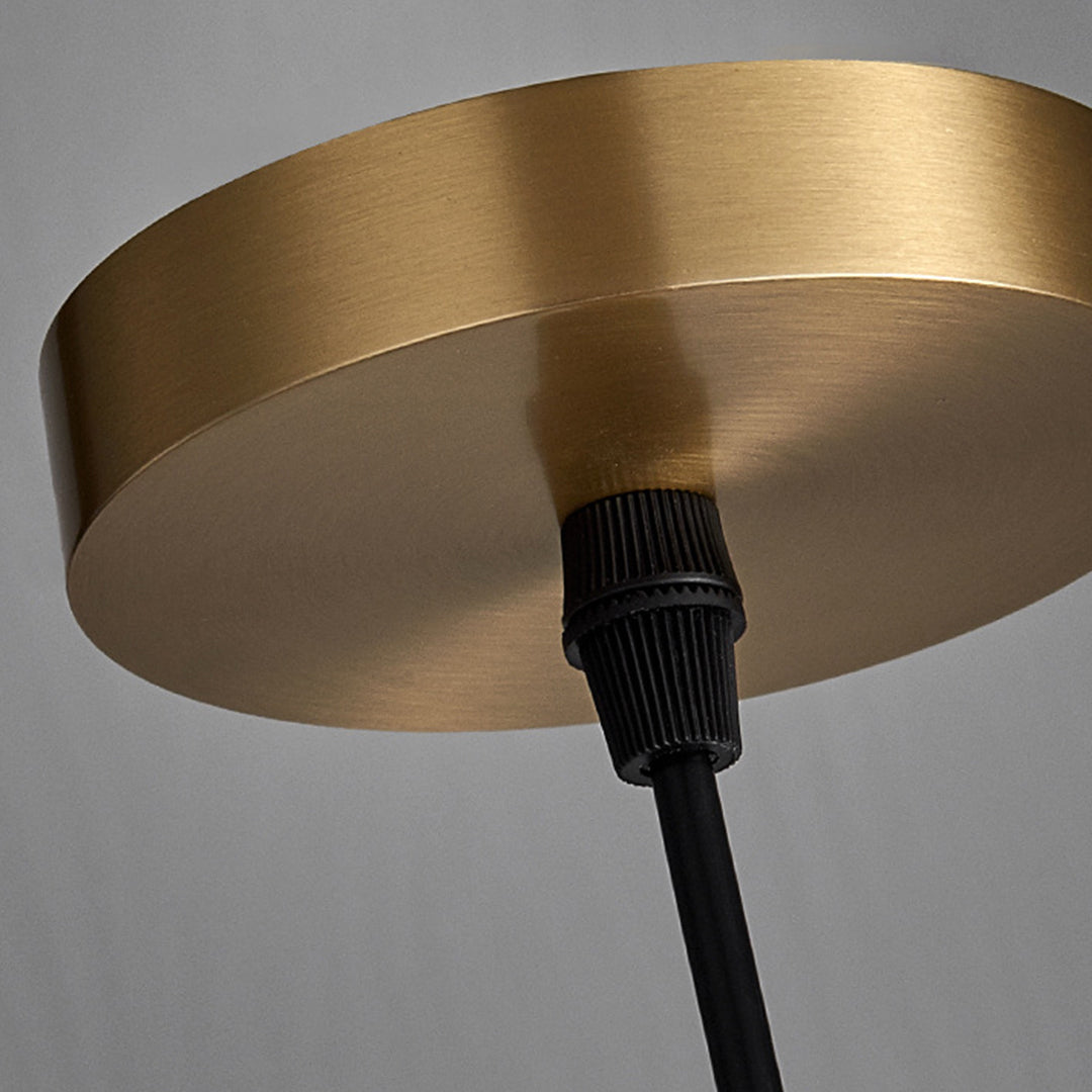Close-up of honeycomb pendant light top, detailed view of gold and layered design