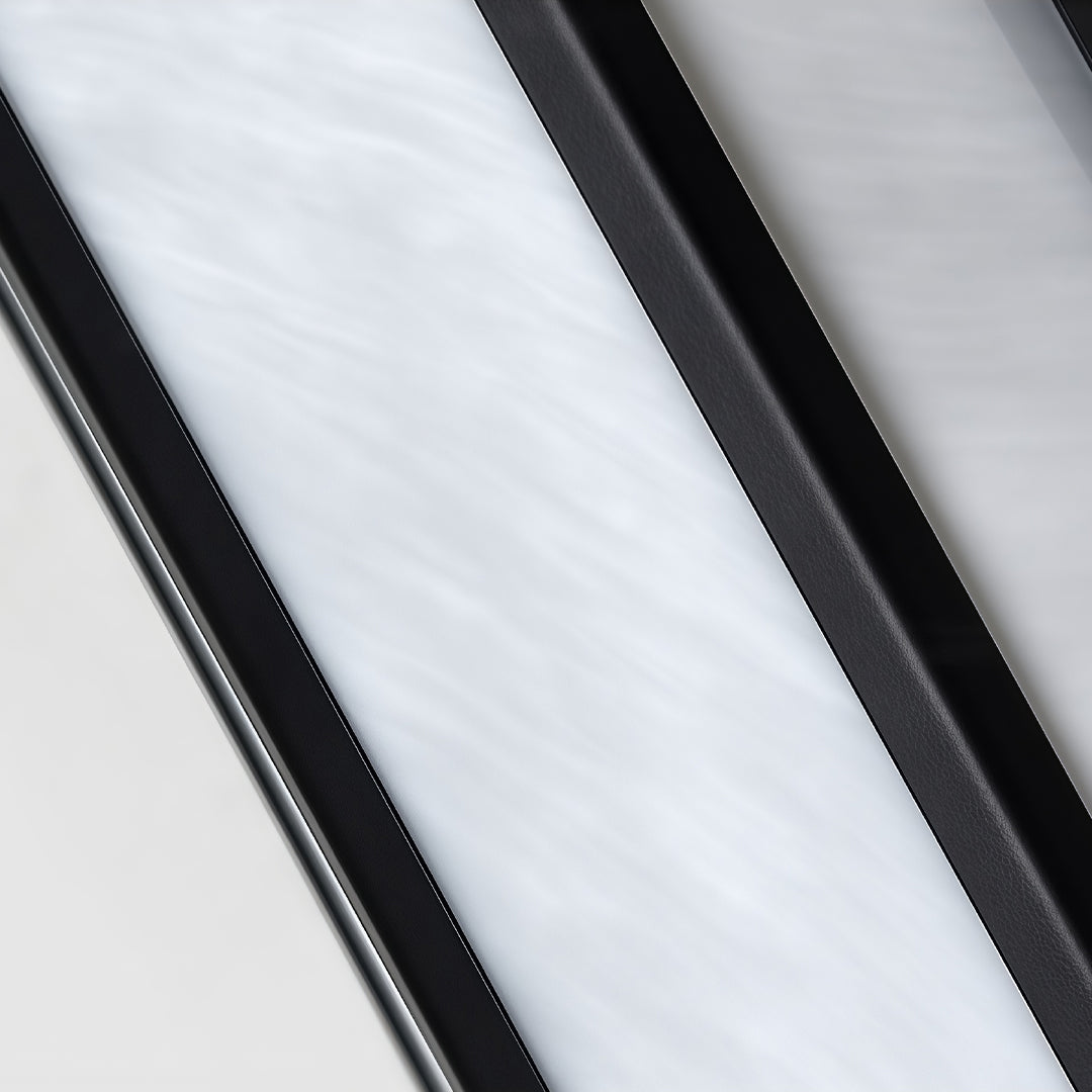 Close-up detail of modern Large Outdoor Wall Light diffuser panel with black metal frame and soft LED glow.