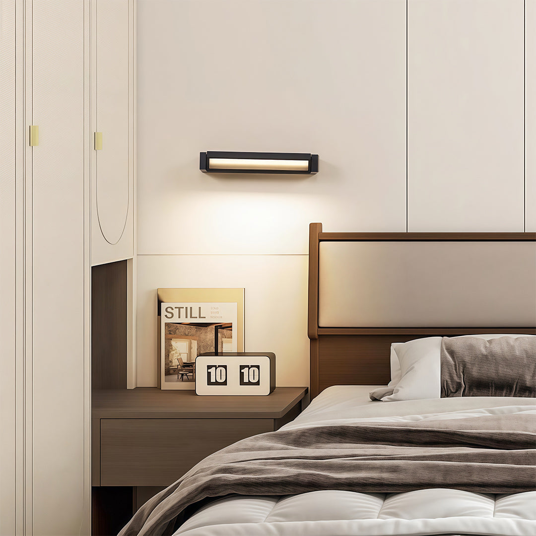 Close-up of LED light bar for wall with glass shade chandelier aesthetic showing ribbed heat sink and mounting detail.