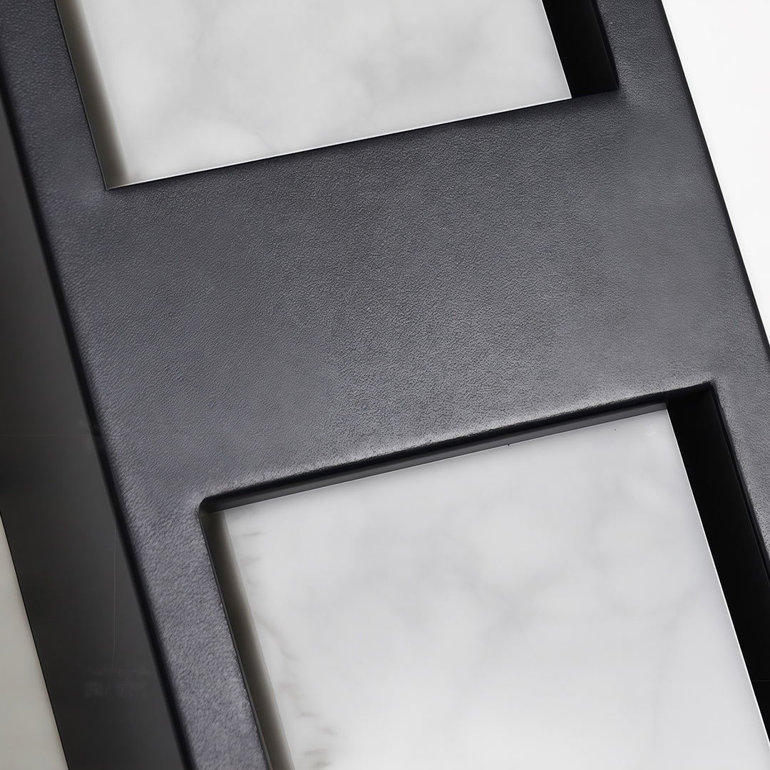 Close-up of LED wall sconce light fixtures with glass shade chandelier styling highlighting illuminated panel and mounting detail.