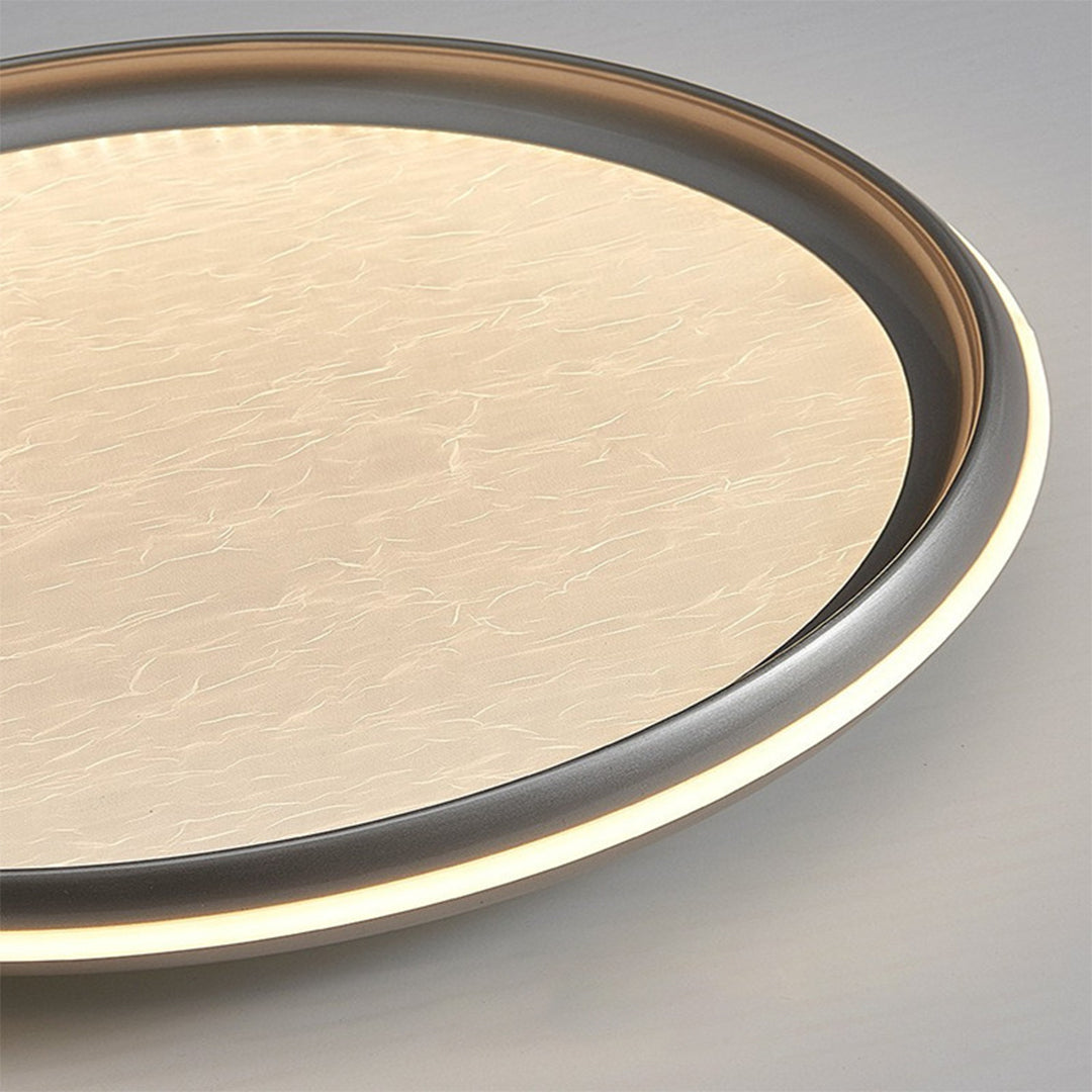 Close-up of metal flush mount light texture, detailed view of brushed metal surface