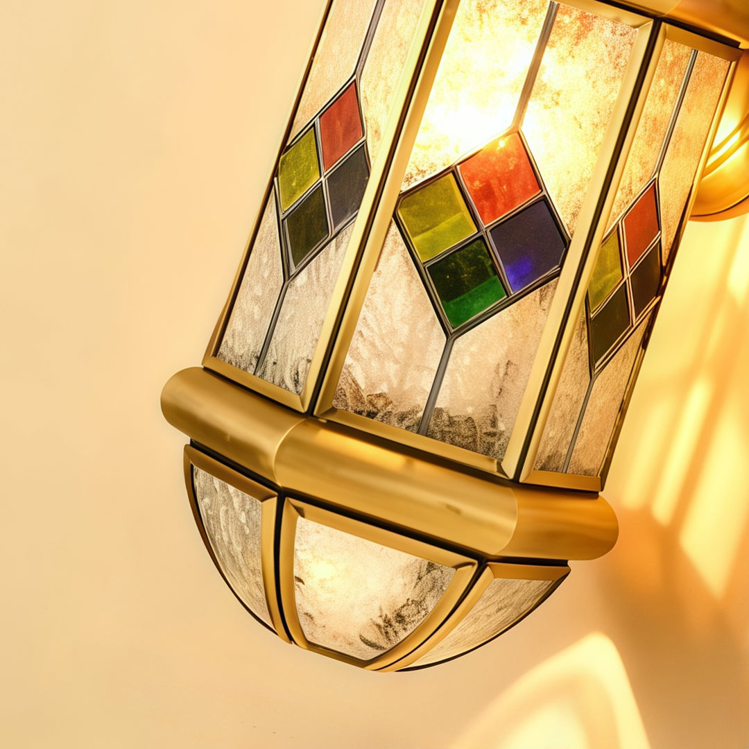 Close-up detail of decorative Outdoor Lantern Wall Lights with stained glass accents and antique brass finish.